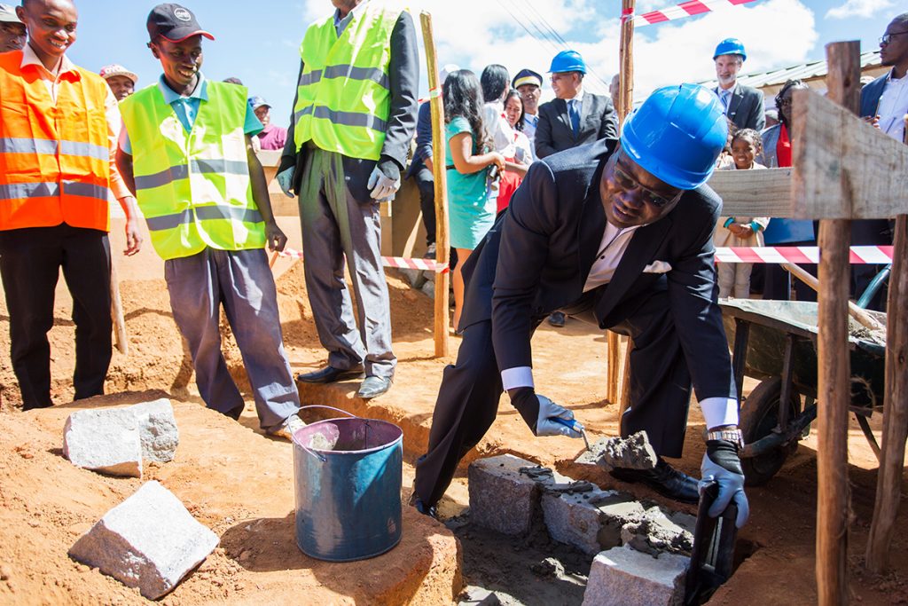 Laying the foundation stone for the school toilet