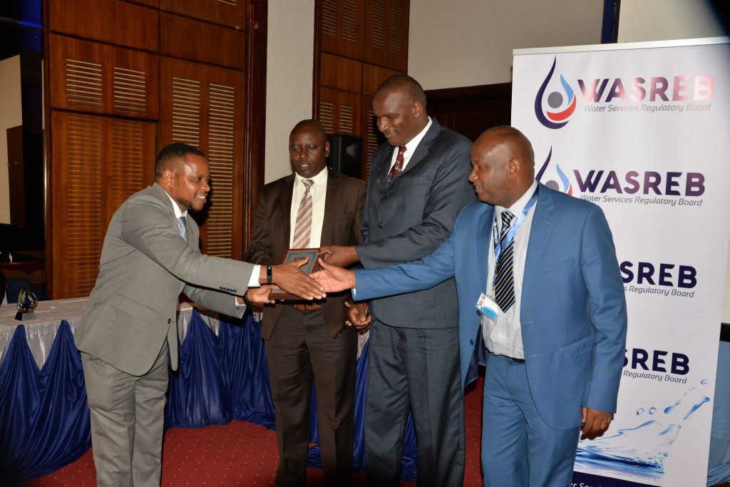 Mugo presenting an award